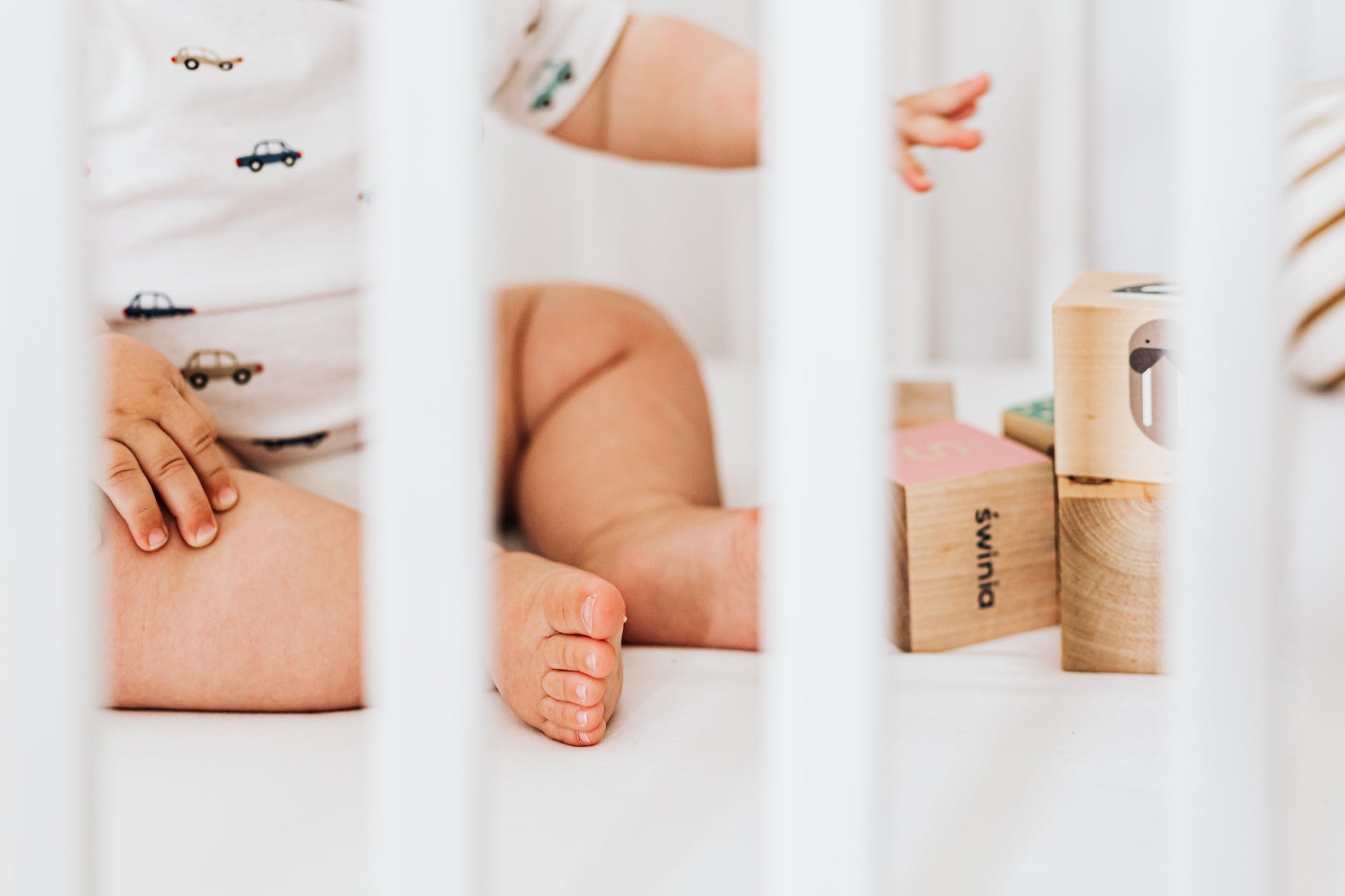 baby sitting in a crib