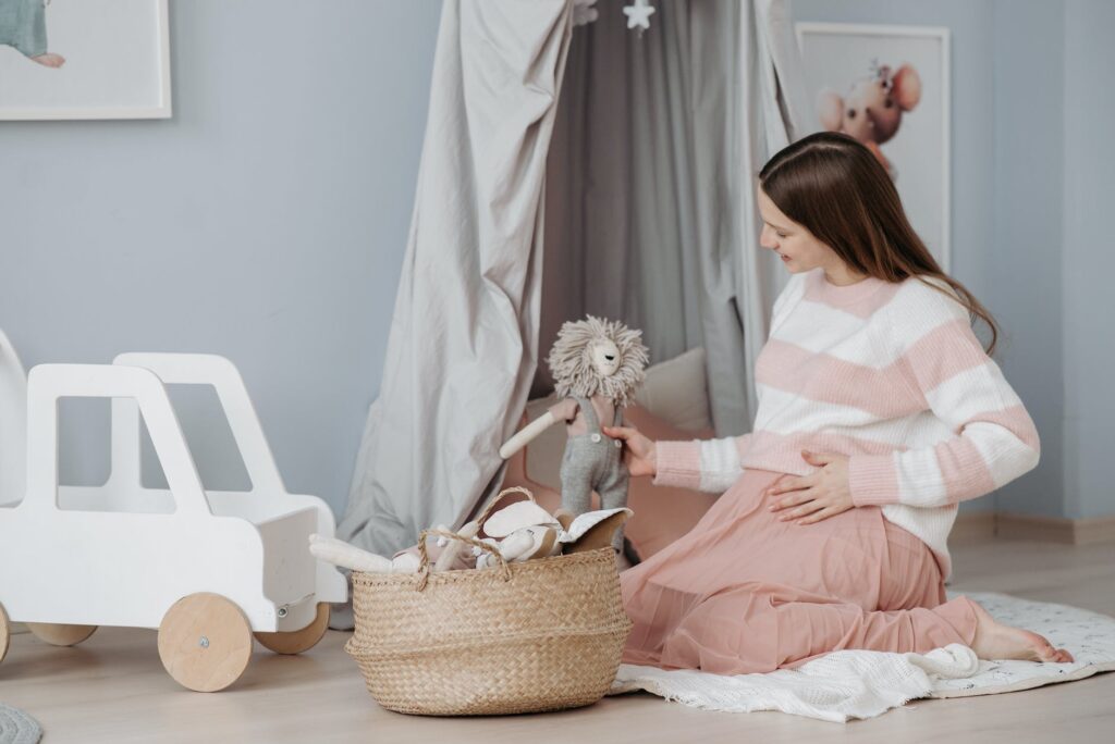 an expectant mother collecting toys for the baby