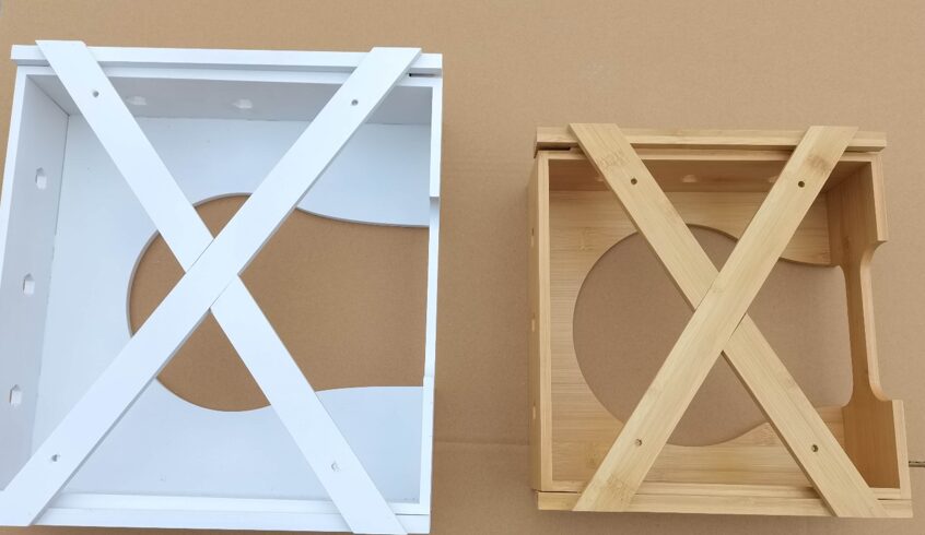 Render image of a bamboo paper plate dispenser frame, showing the detailed structure and cutouts for plate storage