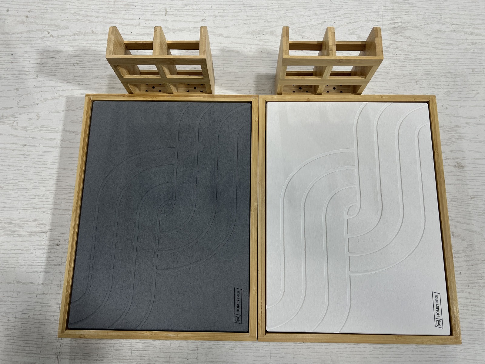 2 Stone drying mats one black and one white with homey panda logo