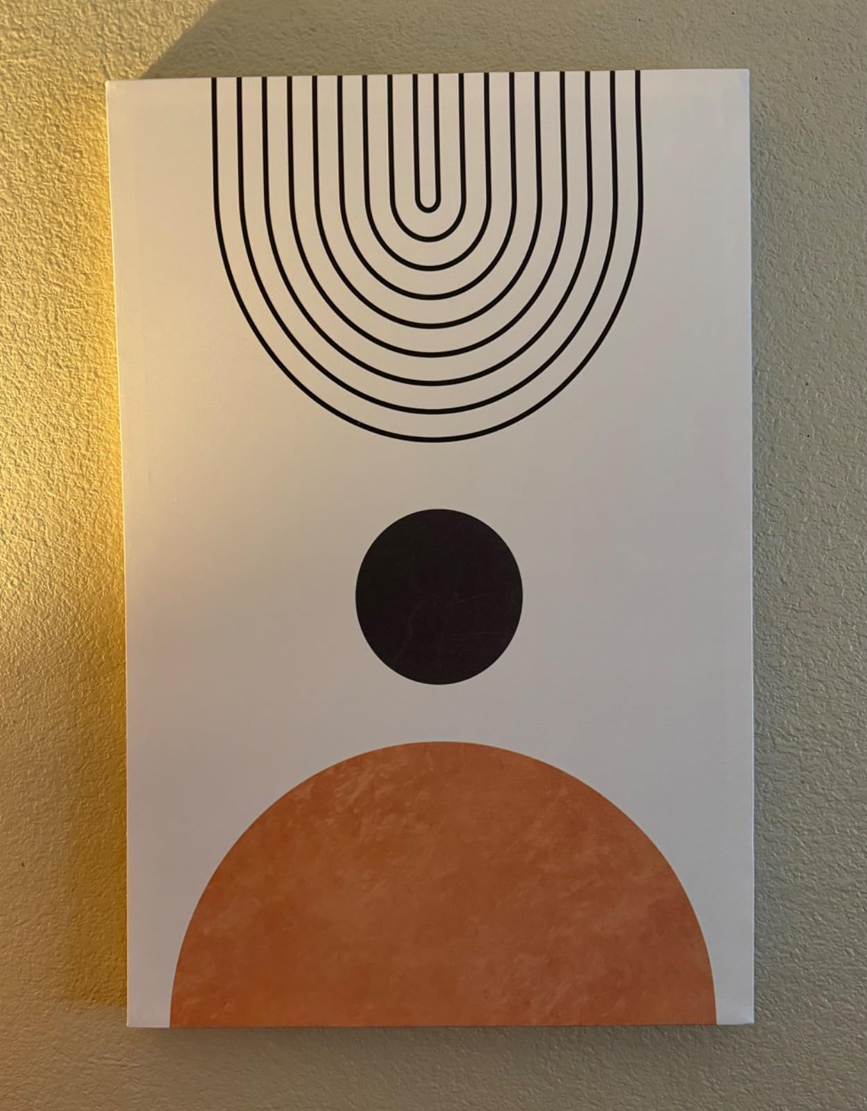 Single boho canvas wall art with a sunburst pattern, black lines radiating from an orange semi-circle, and small orange dots between the lines. A beautiful representation of boho canvas wall art style and design.